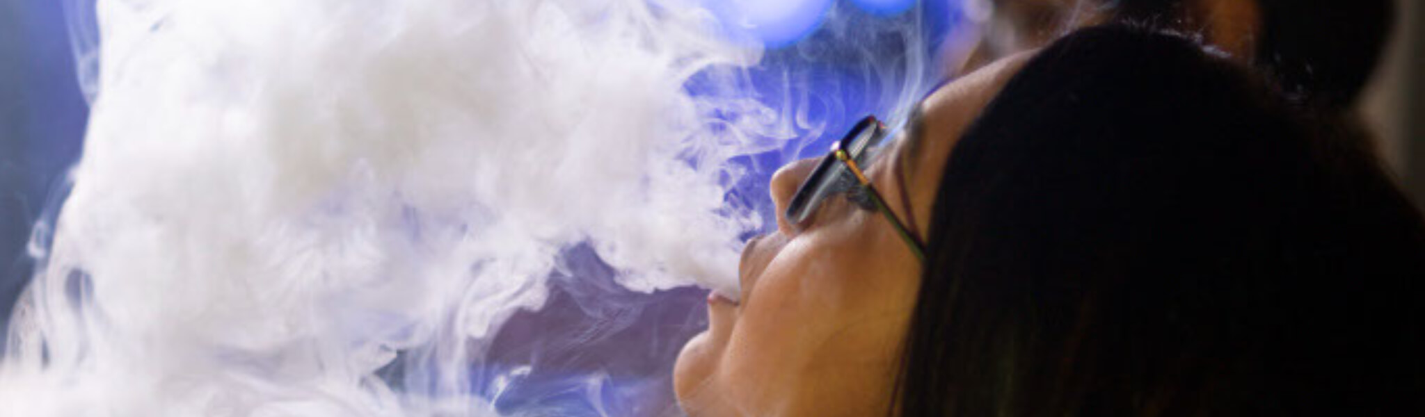 woman smokes weed vape pen