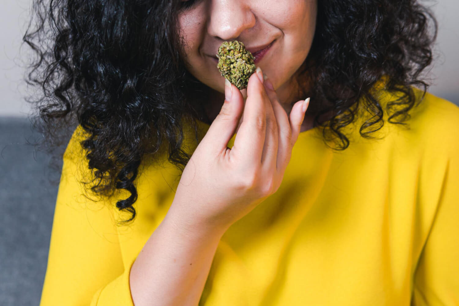 woman smelling weed 